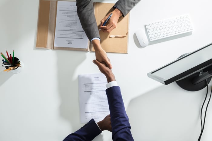 two men shaking hands